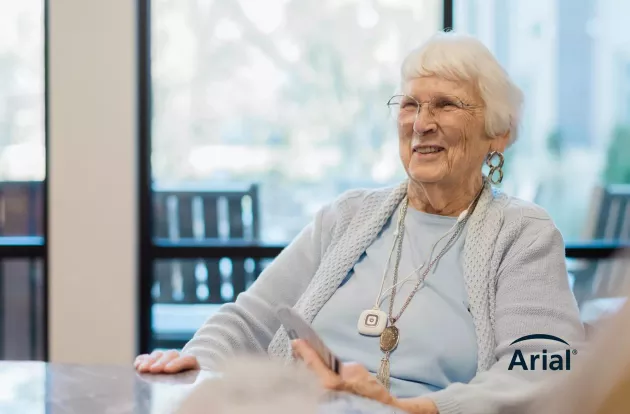 Elderly Woman with Arial Logo